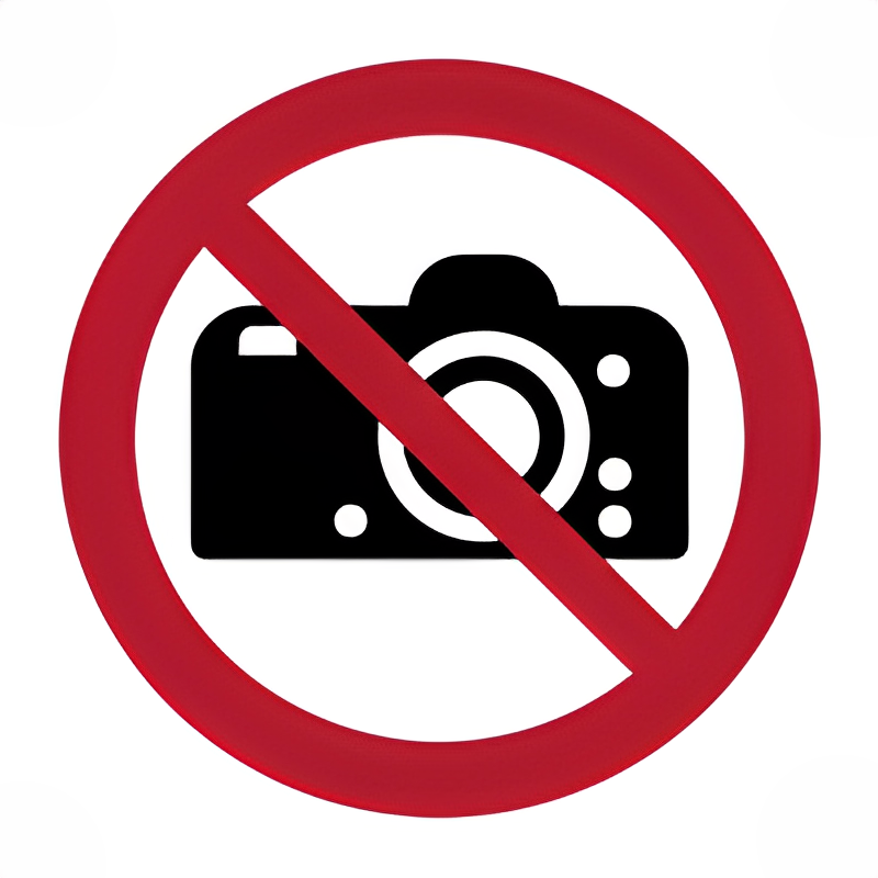 Señal prohibido usar cámaras fotográficas.